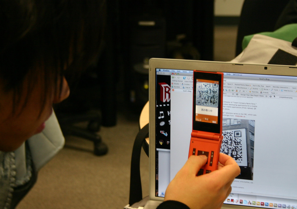 Japanese Visitor Shows QR Code Ready Mobile Phone in Sheridan Interactive Multimedia Class